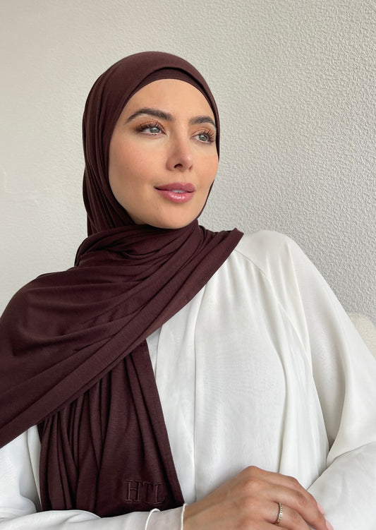 A muslim woman wearing a brown chocolate jersey hijab from hayaa the label ltd.