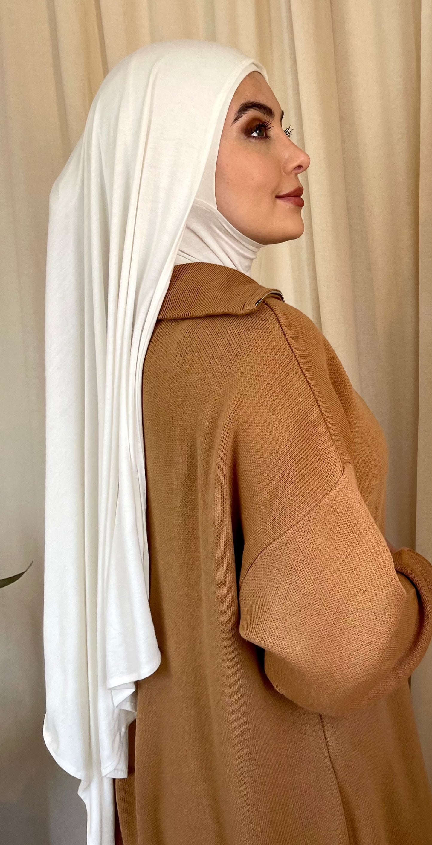 Muslimah covered in luxury hijab. Cotton jersey hijab sets UK. Abaya stores UK