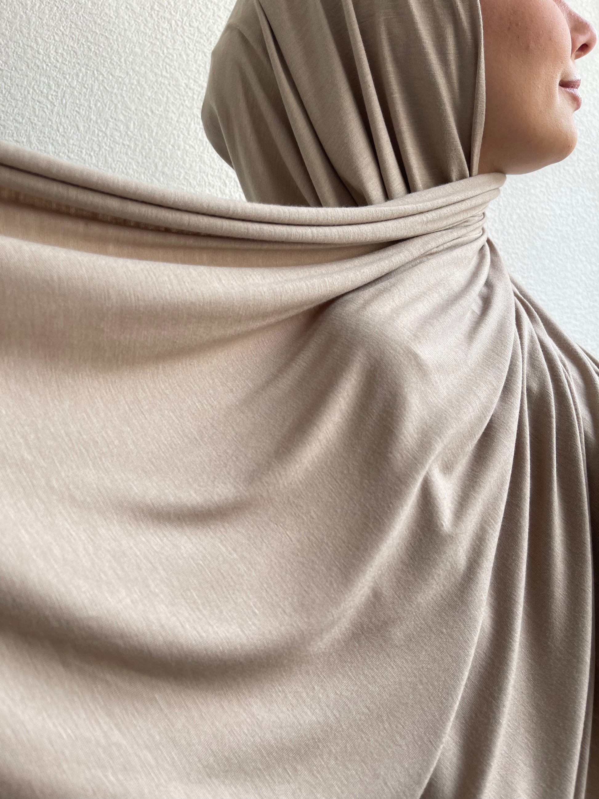 Muslim women wearing luxurious oatmeal maxi hijab from hayaa the label uk.