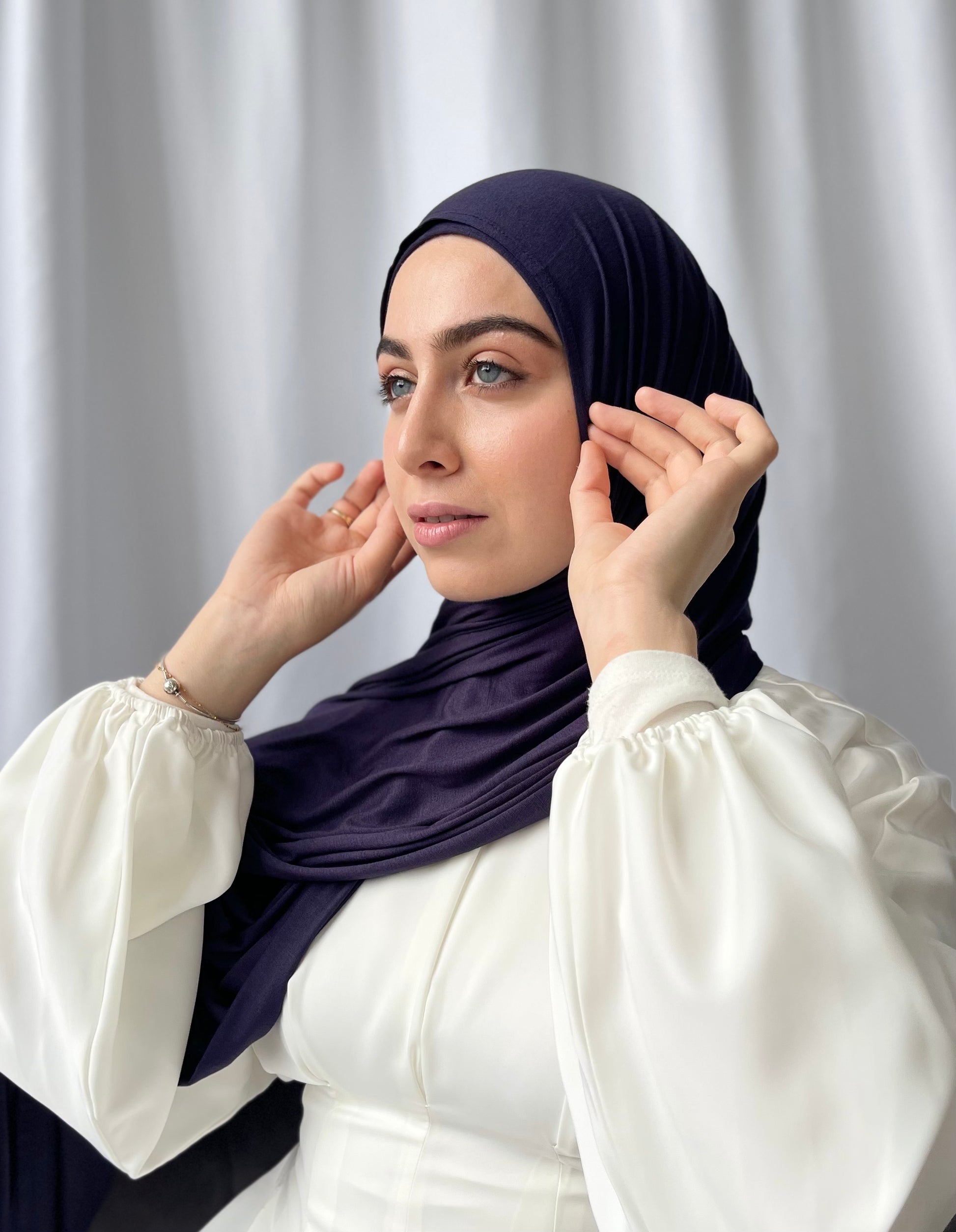 Muslimah covered in luxury hijab. Cotton jersey hijab sets UK. Abaya stores UK
