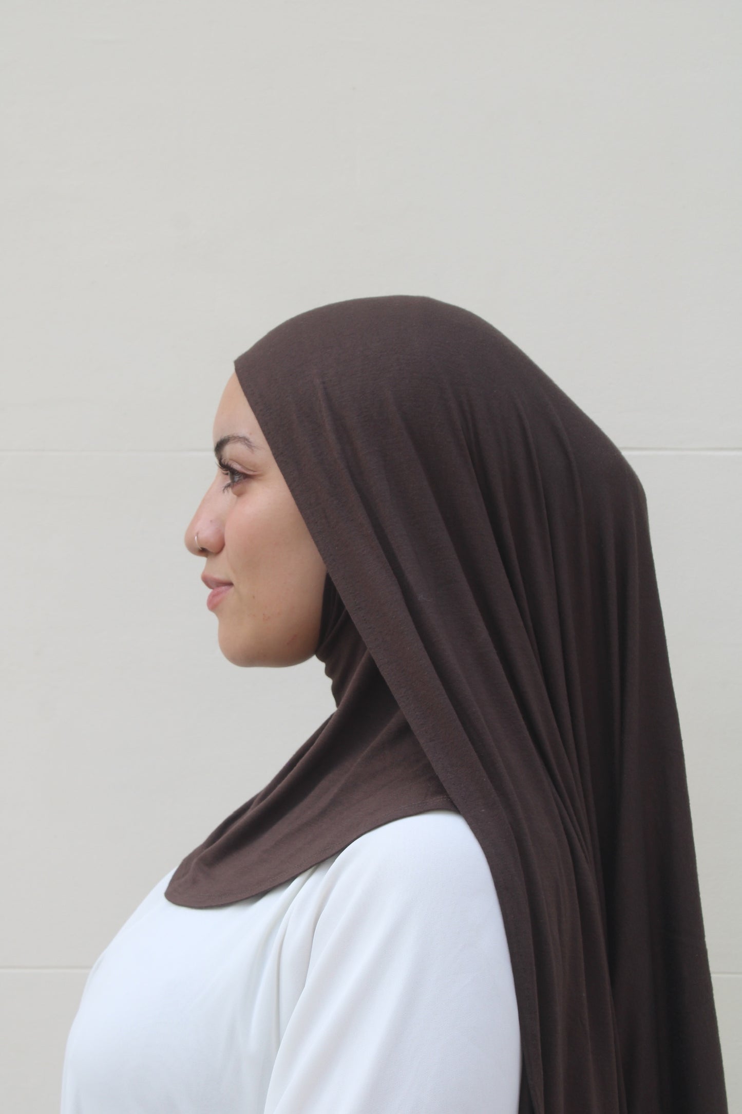 muslim women wearing brown hijab with full coverage ninja cap with adjustable ties 