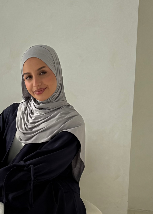 A muslim woman wearing a grey premium lightweight jersey hijab. Best Hijabs online
