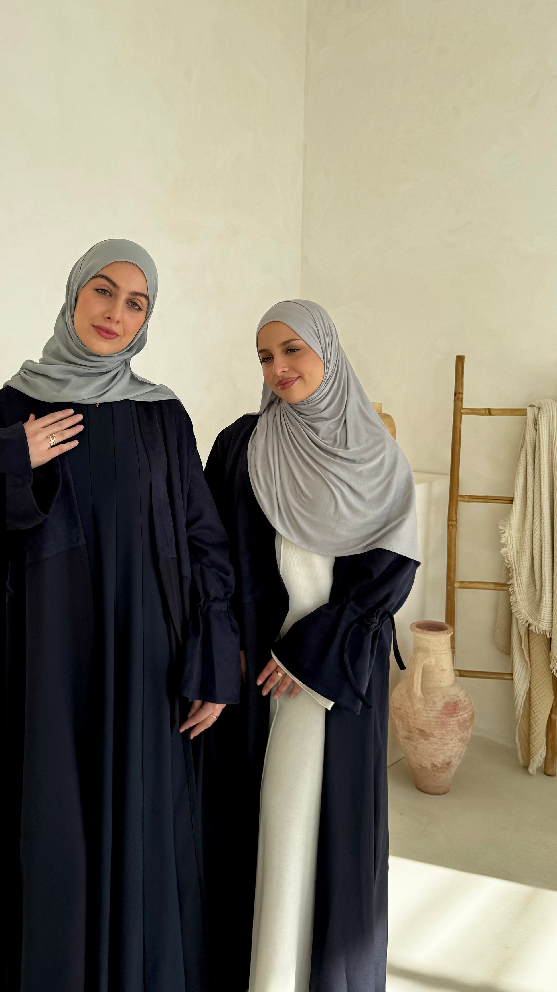 Luxury modest clothing brands. Muslim women wearing matching abaya sets from hayaa the label ltd.